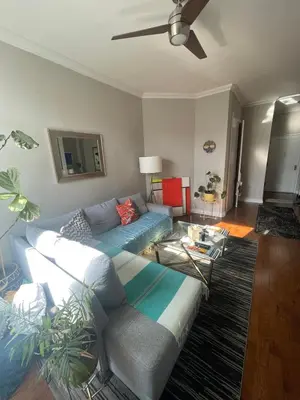 a living room with a couch and a table at Central Park north spacious residence in New York