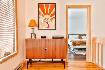 a room with a dresser with a lamp and a bedroom at Secluded Retreat w Hot Tub in Windham in Windham
