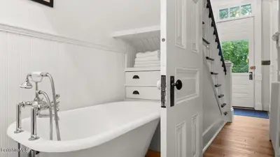 a white bathroom with a bath tub in a room at Berkshire Vacation Rentals 1900s Factory Turned Modern Berkshires Retreat in Great Barrington