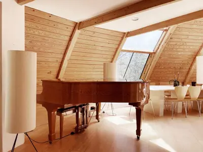 a piano sitting inside of a room with a ceiling at Unique Dome Home With Hot Tub & Piano, on 28 acres in New Paltz