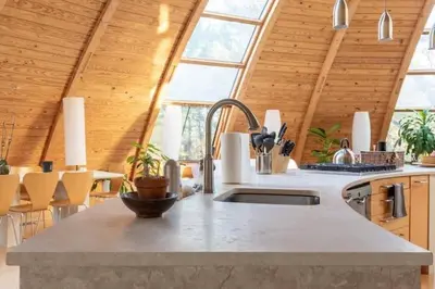 a kitchen with a sink and a large window at Unique Dome Home With Hot Tub & Piano, on 28 acres in New Paltz