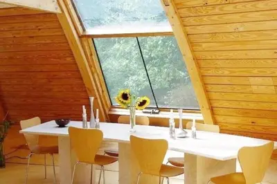a white table and chairs in a room with a window at Unique Dome Home With Hot Tub & Piano, on 28 acres in New Paltz