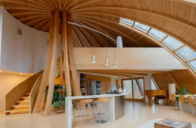 an open kitchen and dining room with a vaulted ceiling at Dome 2Home Villa - Hot Tubs, Sauna & Piano in New Paltz