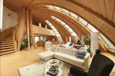 a living room with a white couch and a staircase at Dome 2Home Villa - Hot Tubs, Sauna & Piano in New Paltz