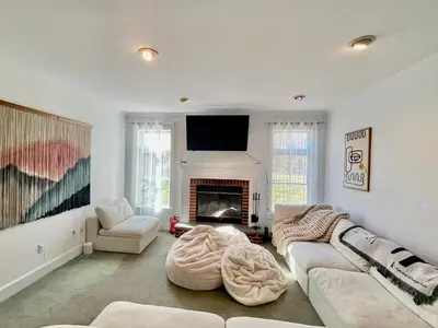 a living room with a couch and a fireplace at Dome 2Home Villa - Hot Tubs, Sauna & Piano in New Paltz