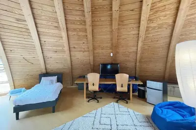 a room with a desk with a computer and two chairs at Dome 2Home Villa - Hot Tubs, Sauna & Piano in New Paltz