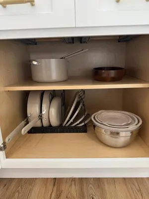 a kitchen cabinet filled with lots of kitchen utensils at Quiet close to NYC BBQ Deck in Jersey City