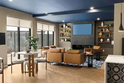 a living room with a couch and chairs and a tv at Luxury Apartments by Hyatus White Plains in White Plains