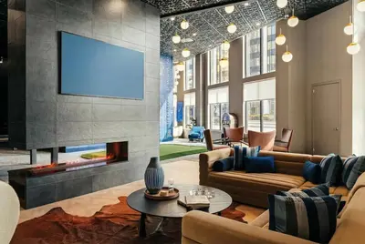 a living room with a fireplace and a tv at Luxury Apartments by Hyatus White Plains in White Plains