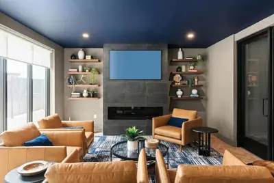 a living room with a couch and a tv at Luxury Apartments by Hyatus White Plains in White Plains