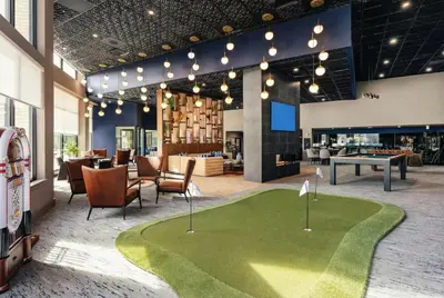 a golf course in the middle of a lobby at Luxury Apartments by Hyatus White Plains in White Plains