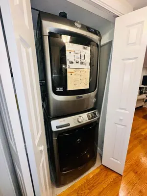 a microwave oven in a room with a door at coastal and cozy beach stay, pet friendly in Milford