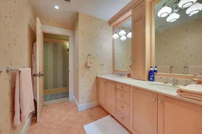 a bathroom with a sink and a large mirror at Hot Tub, Gym, Game Room! Luxe Estate in Longmeadow in Longmeadow