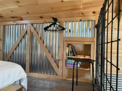 a room with a bed and a desk in a cabin at Countryside Views in Norwich