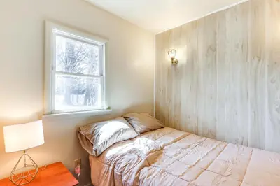 a bedroom with a bed and a window at 1 Mi to Dtwn Saratoga Springs Cozy Duplex Apt! in Saratoga Springs