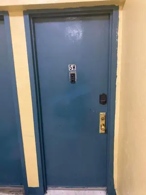 a blue door with a slow sign on it at Bronx City Stay Private Room Near Manhattan in Kings Bridge Heights