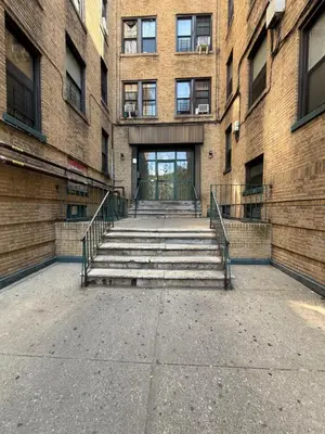 a stairway leading to a building with a door at Bronx City Stay Private Room Near Manhattan in Kings Bridge Heights