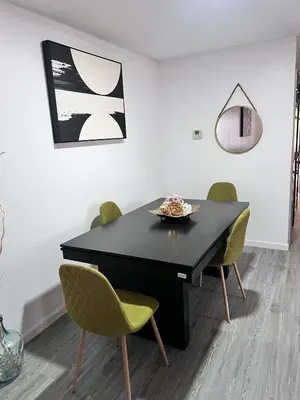 a dining room with a black table and chairs at Exquisite Luxury 3KINGs Bed, 2 Bath in Newark
