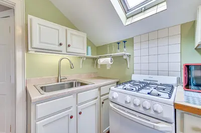 a kitchen with a stove and a sink at Quaint and Charming Cherry Valley Escape! in Cherry Valley