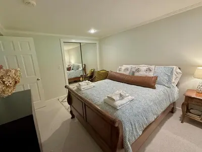 a bedroom with a bed with towels on it at Beautiful House in the Woods, Huge Yard, Hot Tub in Great Barrington