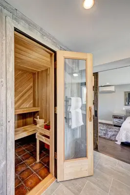 a sliding glass door in a room with a bedroom at Longpond Farm House and Loft in Salisbury