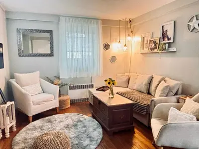 a living room with a couch and two chairs at Neighborhood Apt-walk to Train-McLean Ave, 30mins to NYC in Yonkers