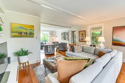 a living room with a couch and a table at 1 Mi to Vineyard Serene Berkshires Country Escape in Richmond