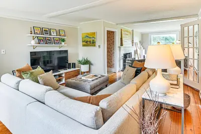 a living room with a couch and a table at 1 Mi to Vineyard Serene Berkshires Country Escape in Richmond