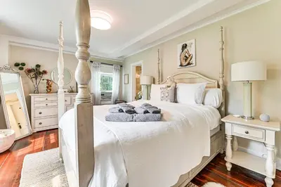 a bedroom with a large white bed with two pillows at 1 Mi to Vineyard Serene Berkshires Country Escape in Richmond
