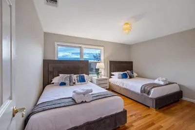 a bedroom with two beds and a window at Huge Retreat w Alaska King, Pool & Jacuzzi Tub Indoor in Goshen