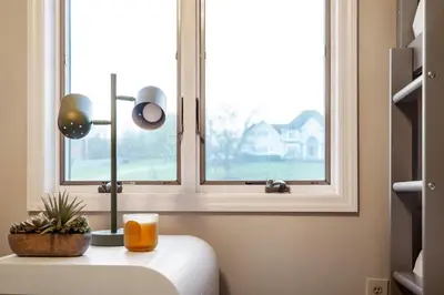 a window in a room with a table and a candle at Huge Retreat w Alaska King, Pool & Jacuzzi Tub Indoor in Goshen
