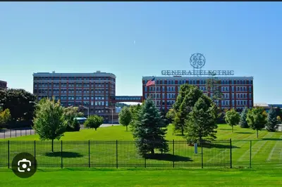 a park with trees and buildings in the background at 3 bedroom 1 bathroom apartment , free private parking in Schenectady