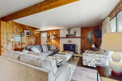 a living room with a couch and a fireplace at Ski Haus Retreat in West Dover