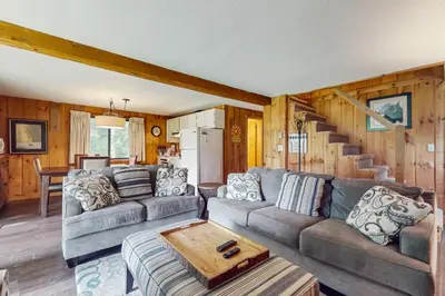 a living room with a couch and a table at Ski Haus Retreat in West Dover
