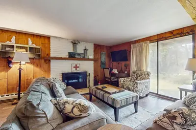 a living room with a couch and a fireplace at Ski Haus Retreat in West Dover