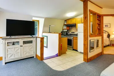 a kitchen with a tv on top of a white refrigerator at Ashokan Reservoir Treetop Suite in the Catskills in Olivebridge