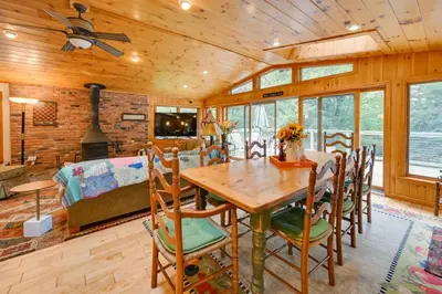 a dining room and living room with a table and chairs at Tolland Lake Escape Kayaks Deck and Nature Trails in Sandisfield