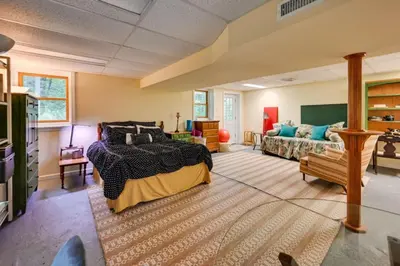 a large room with a bed and a couch at Tolland Lake Escape Kayaks Deck and Nature Trails in Sandisfield
