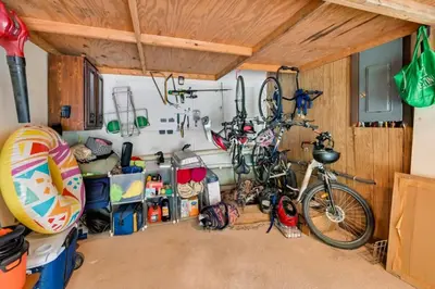 a garage with a bike parked in a room at Tolland Lake Escape Kayaks Deck and Nature Trails in Sandisfield