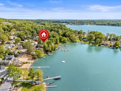 an aerial view of a lake with a sign on it at Lake Me Home in East Hampton