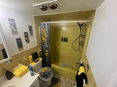 a bathroom with a shower and a sink and a toilet at Elegance Escape