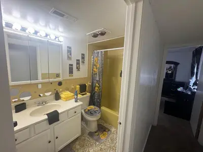 a bathroom with a sink and a toilet and a mirror at Elegance Escape
