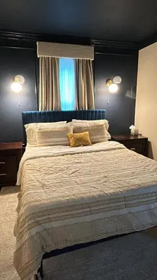 a bedroom with a large bed with two pillows at Morristown Charm in Morristown