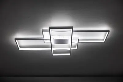a light hanging from the ceiling in a room at Newly renovated luxury 3BR Condo! 30 mins to NYC in Jersey City
