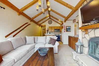 a living room with a couch and a fireplace at 17A Mountain Village #241 in Dover