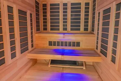 a wooden sauna with blue lights in it at 17A Mountain Village #241 in Dover