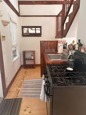 a kitchen with a stove and a sink at Cute Cozy Cottage Glenford New York in Glenford