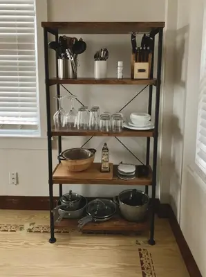 a shelf with bowls and utensils in a kitchen at Cute Cozy Cottage Glenford New York in Glenford