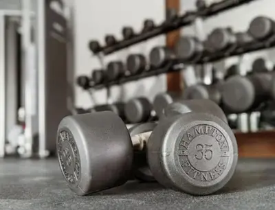 a group of dumbbells on the floor in a gym at Hampton Inn & Suites By Hilton North Haven in North Haven