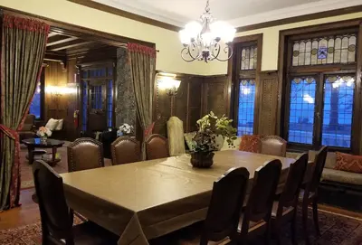 a dining room with a table and chairs at Waterfront Retreat Center in New Rochelle
